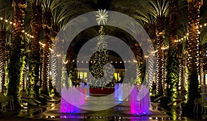 Arizona shopping mall Christmas Tree and lighted palm trees photo