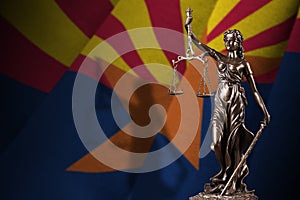 Arizona US state flag with statue of lady justice and judicial scales in dark room. Concept of judgement and punishment