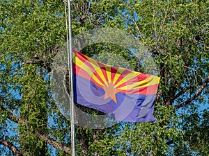 Arizone flag swining and at half-staff