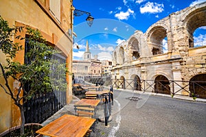 Arles Amphitheatre and colorful street architecture view photo