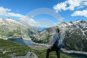Arlhoehe - A man admiring an artificial lake in Austria