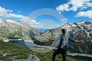 Arlhoehe - A man admiring an artificial lake in Austria