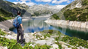 Arlhoehe - A man enjoying a sunny day at the Alpine lake