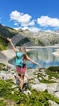 Arlhoehe - A woman enjoying the sunny day at the Alpine lake