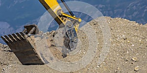 Arm and bucket of heavy duty construction vehicle