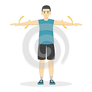 Arm circles exercise. Man in sport clothes doing warm-up