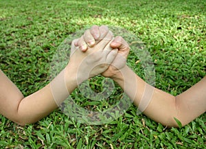 Arm wrestle on the grass