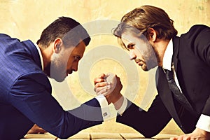 Arm wrestling of businessman and compete man