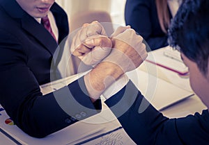 Arm wrestling in meeting for business competitive concept