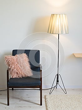 Armchair and lamp in minimal interior