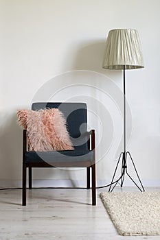 Armchair and lamp in minimal interior