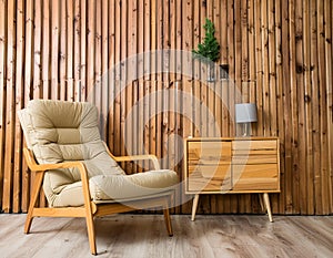 Armchair and wooden cabinet near wooden planks paneling wall. Loft interior design of modern