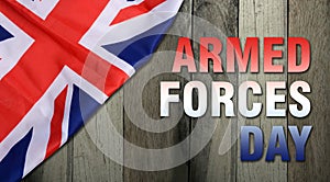 Armed forces day on wooden background - flag of the United Kingdom UK