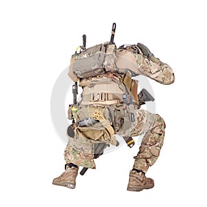Infantryman hiding from explosion studio shoot isolated on white photo