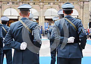 Armed policemen lined up in the city square before performing the ceremony - The Army soldiers standing in row they are wearing