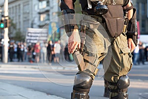 Armed riot police officer on duty during street protest