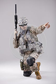 Armed Soldier pointing with finger