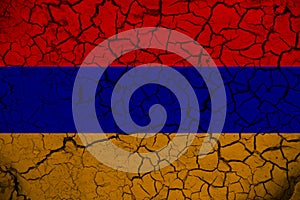 Armenia flag on the background texture of cracked earth. The concept of design solutions