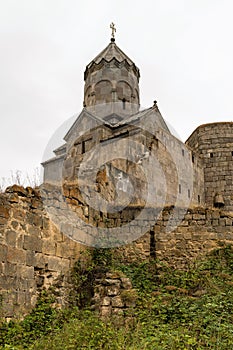 Armenia, Tatev, September 2022. View of the temple of St. Minas from behind the wall of the monastery.