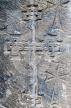 Armenia, Tatev, September 2022. Traditional Armenian cross on the stone wall of the church.