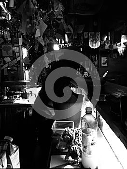 Armenia, Yerevan, Pushkin street.  Pub â€œCalumetâ€ on August 18, 2019, the bartender is working, black and white photo