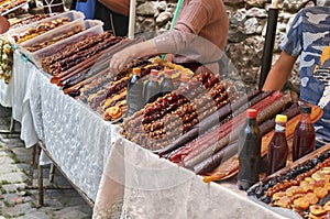 Armenian peasants sell tasty handmade fruit sweets on the market outdoors