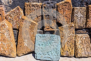 Armenian stone cross called khachkar on the territory of the ancient monastery of Sevanavark in Armenia