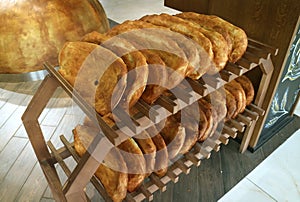 Armenian traditional breads for sale on the bakery wooden shelfs