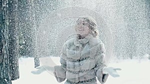 Armful of snow crumbles tiny snowflakes on the bride