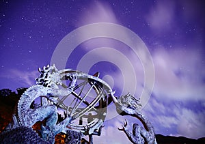 Armillary sphere with galaxy sky