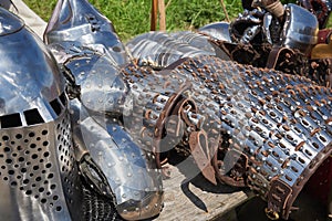 Armor of participants in the competition for the Medieval Battle. Ð¢hÐµrÐµ are a helmet, plate armor, bracers  and metal mittens