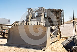 Armored military bulldozer presented on military show