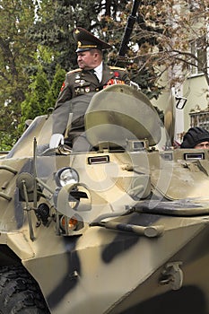 The armored personnel carrier heading a column of military equip