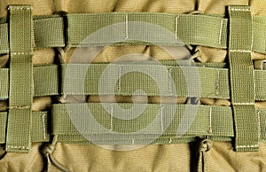 Armored vest olive colored molle system.