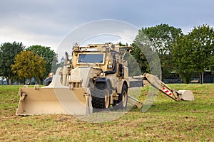 Armored wheel loader in deser camouflage