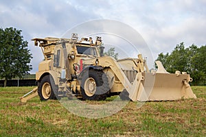 Armored wheel loader in deser camouflage