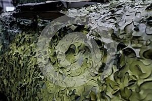 Armoured military vehicle camouflage cover - tarpaulin mesh, closeup detail