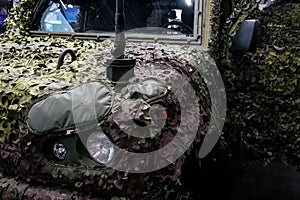 Armoured military vehicle camouflage cover - tarpaulin mesh, closeup detail