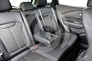 Armrest in the car with cup holder for rear seats row