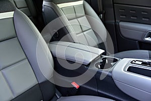 Armrest in the luxury passenger car between the front seats photo