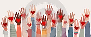 Arms and hands raised. Group of diverse people with heart in hand. Charity donation and volunteer work. Support and assistance