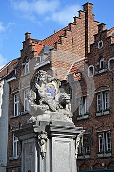 The Arms of the town Bruge. Sculpture with lion and bear in Bruges photo