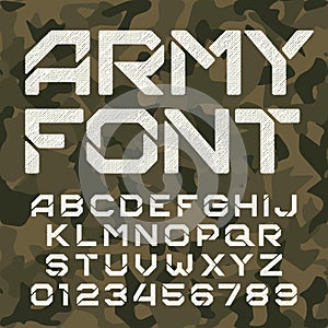 Army alphabet typeface. Scratched messy letters and numbers on camo background.