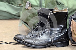 Army boots with duffle bag and dog tages