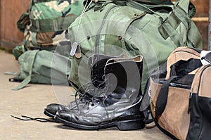 Army boots with duffle bag and dog tags