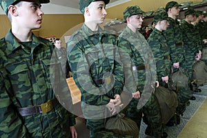 Army conscripts receiving military uniform