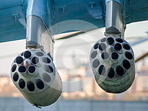 army military rocket launcher on the wing of an airplane