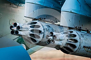 army military rocket launcher on the wing of an airplane