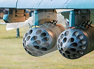 army military rocket launcher on the wing of an airplane