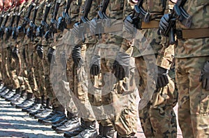 Army parade - armed soldiers in camouflage military uniform